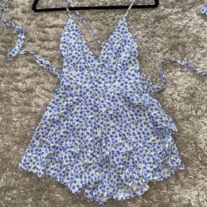 Blue romper with flowers, size small, never worn